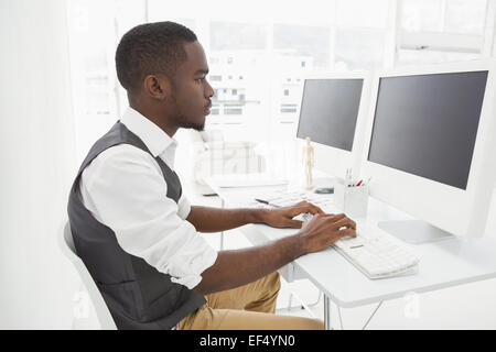 Classy businessman concentrating and using computer Stock Photo
