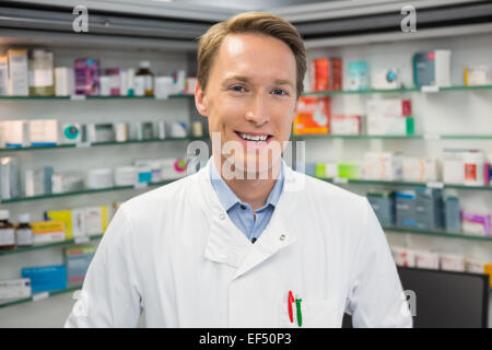 Handsome pharmacist smiling at camera Stock Photo - Alamy