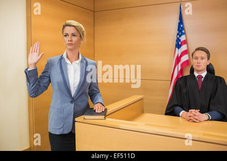 Witness taking an oath Stock Photo