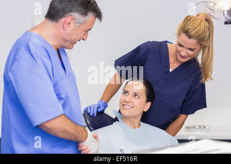 Dentist and nurse introducing a patient Stock Photo