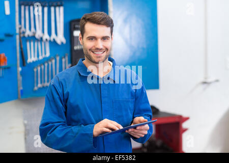 Mechanic using a tablet pc Stock Photo