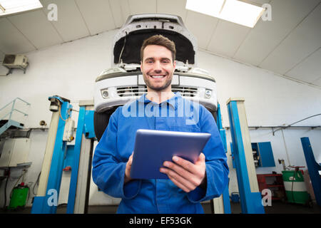 Mechanic using a tablet pc Stock Photo