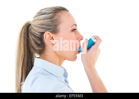 Pretty Inhaler Pretty blonde using an asthma inhaler Stock Photo - Alamy
