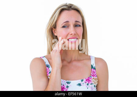 Beautiful blonde getting teeth pain Stock Photo