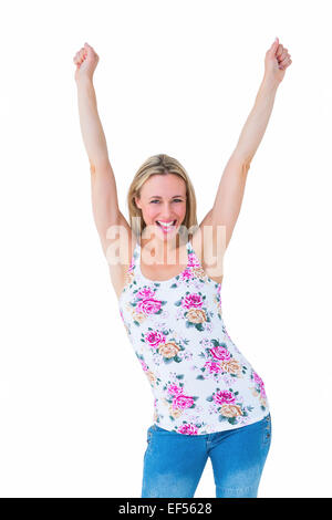 Happy blonde cheering with arms up Stock Photo