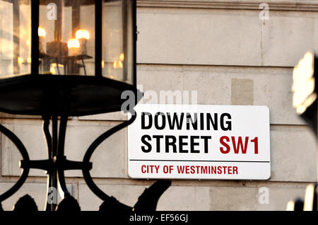 London, England, UK. Downing Street: Street sign and lamp on the high security gates Stock Photo