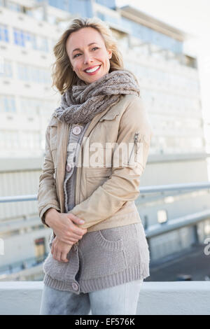 Happy blonde in warm clothes posing Stock Photo