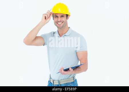 Architect wearing hard hat while holding clip board Stock Photo