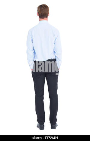 Rear view of businessman with hands in pockets Stock Photo