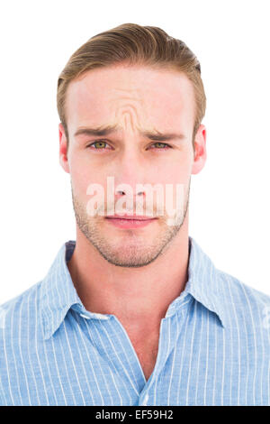 Portrait of doubtful man in shirt Stock Photo