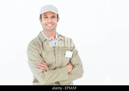 Confident delivery man standing arms crossed Stock Photo