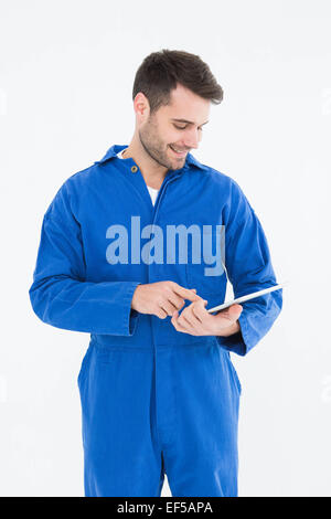 Male mechanic using digital tablet Stock Photo