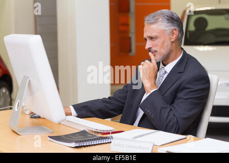 Focused businessman using his laptop Stock Photo