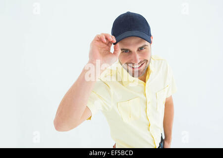 Handsome delivery man wearing baseball cap Stock Photo