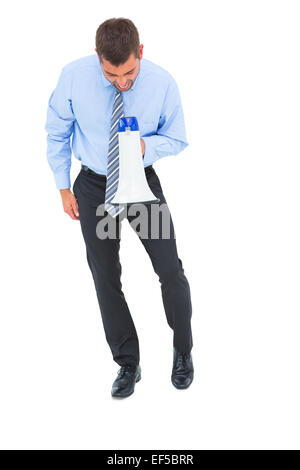 Businessman shouting through megaphone Stock Photo