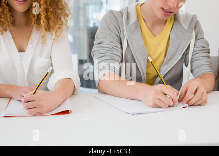 Students taking notes in class Stock Photo