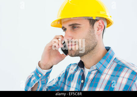 Construction worker using mobile phone Stock Photo