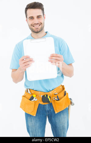 Construction worker showing blank paper on clipboard Stock Photo