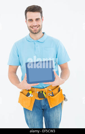 Construction worker showing blank screen on digital tablet Stock Photo