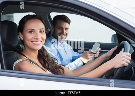 Young woman getting a driving lesson Stock Photo