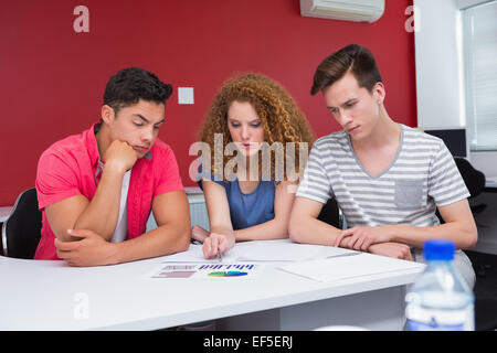 Concentrated students working together Stock Photo