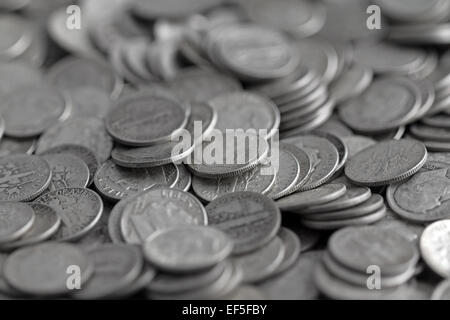 A group of old silver bullion United States dimes with the center in focus. Stock Photo