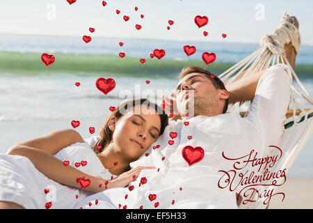Composite image of peaceful couple napping in a hammock Stock Photo