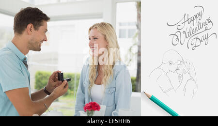 Composite image of man proposing marriage to his blonde girlfriend Stock Photo