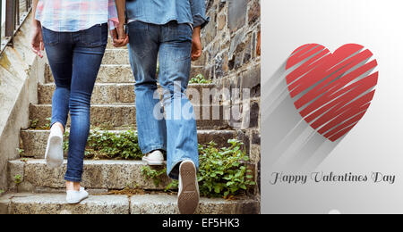 Composite image of hip young couple walking up steps Stock Photo