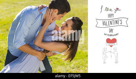 Composite image of loving and happy couple dancing in park Stock Photo
