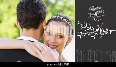 Composite image of portrait of happy bride embracing groom Stock Photo