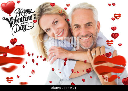 Composite image of cute valentines couple Stock Photo