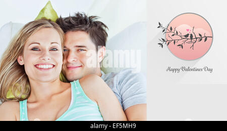 Composite image of cute valentines couple Stock Photo