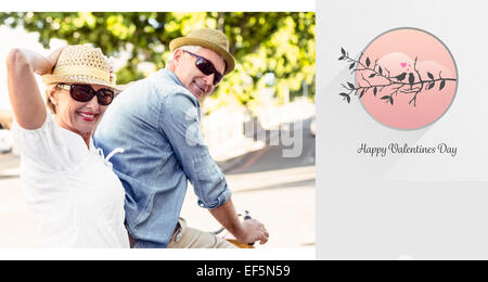 Composite image of cute valentines couple Stock Photo