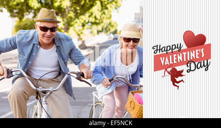 Composite image of happy mature couple going for a bike ride in the city Stock Photo