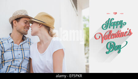 Composite image of young hip couple sitting on bench about to kiss Stock Photo