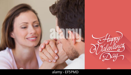 Composite image of close-up of a loving couple holding hands Stock Photo