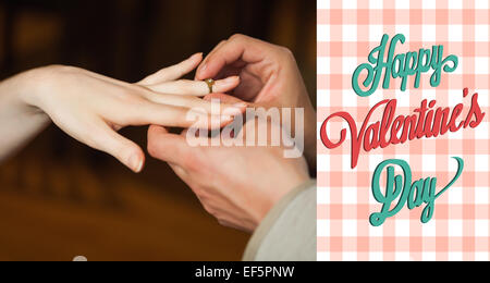 Composite image of cute valentines couple Stock Photo