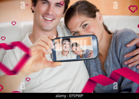 Composite image of valentines couple Stock Photo