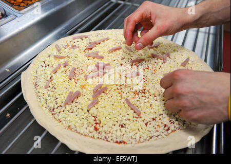Close up making Pizzas in a takeaway, Leeds Stock Photo