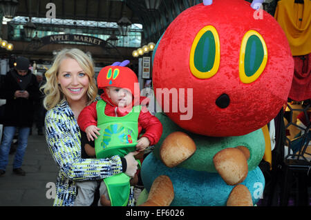 London, UK, 27 January 2015, London's historic Apple Market in Covent Garden was transformed into a scene from The Very Hungry Caterpillar as TV presenter Laura Hamilton with one year old son Rocco and pupils from ST Clements Danes school teamed up with leading charity Action for Children to launch the annual fundraising campaign for children, The Giant Wiggle, taking place on 19 March . Credit:  JOHNNY ARMSTEAD/Alamy Live News Stock Photo