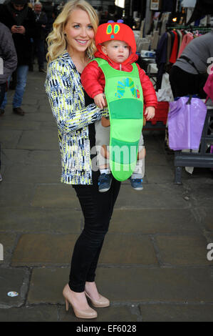 London, UK, 27 January 2015, London's historic Apple Market in Covent Garden was transformed into a scene from The Very Hungry Caterpillar as TV presenter Laura Hamilton with one year old son Rocco and pupils from ST Clements Danes school teamed up with leading charity Action for Children to launch the annual fundraising campaign for children, The Giant Wiggle, taking place on 19 March . Credit:  JOHNNY ARMSTEAD/Alamy Live News Stock Photo