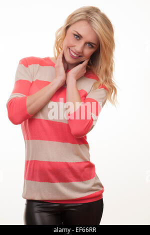 blonde woman smiling wearing a stripy jumper Stock Photo