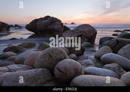 The sun sets over Porth Nanven, Cornwall Stock Photo