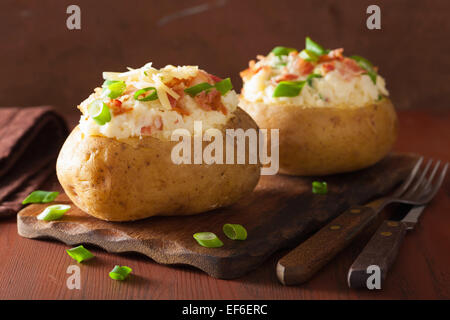 baked potato in jacket with bacon and cheese Stock Photo