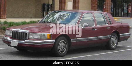 The 1990-1992 Lincoln Town Car is a full-size luxury sedan offering a smooth ride, spacious interior, and premium features. Known for its classic design and comfort, the Town Car is a popular choice for those seeking a high-end, comfortable vehicle for long drives and executive use. Stock Photo