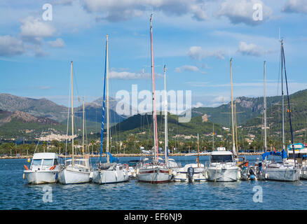 PORT D'ANDRATX, MAJORCA, SPAIN - ON OCTOBER 31 2013: Small boats moored with a view towards the village of Andratx Stock Photo