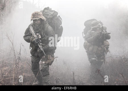 Group of soldiers in the smoke Stock Photo