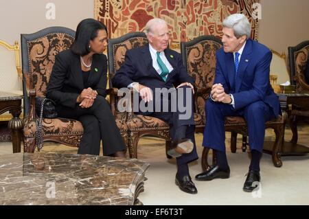 US Secretary of State John Kerry speaks with former Secretaries of State James Baker and Condoleezza Rice at King Khaled International Airport, as they await for President Obama to arrival January 27, 2015 in Riyadh, Saudi Arabia. US leaders arrived to extend condolences to the late King Abdullah and meet with the new King Salman. Stock Photo