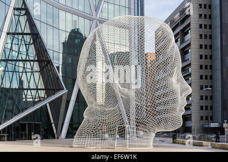 Sculpture titled 'Wonderland' by Jaume Plensa. The Bow Tower, Calgary, Alberta, Canada Stock Photo